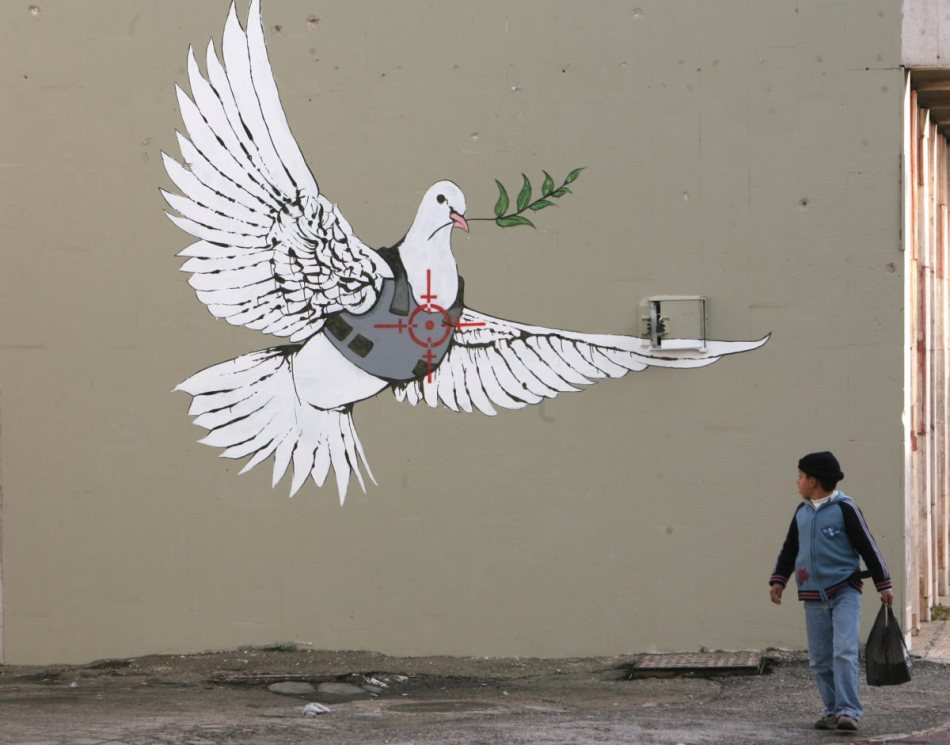 in-2007-banksy-visited-bethlehem-during-christmas-time-to-unveil-six-new-works-on-the-walls-of-the-city-in-an-attempt-to-bring-cheer-and-boost-tourism