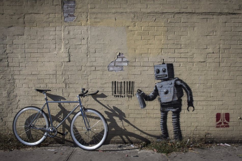 this-robot-graffiti-artist-tagging-a-wall-with-a-barcode-what-else-was-part-of-bankys-well-publicized-and-shadowy-residency-in-new-york-city-last-year
